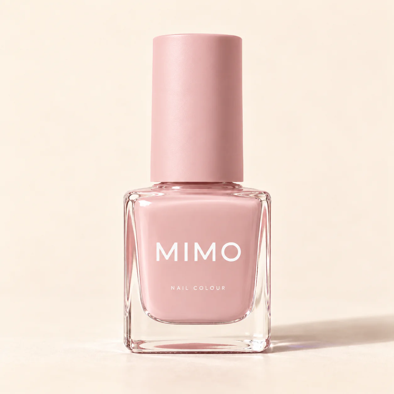 MIMO Nail Colour in Blush Pink: a square glass bottle with a matching cap on a cream background.